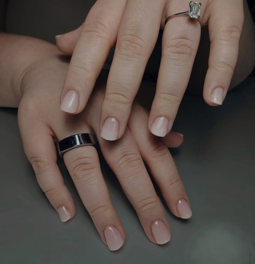 Hands with a soft babyboomer fade from nude to a milky tip
